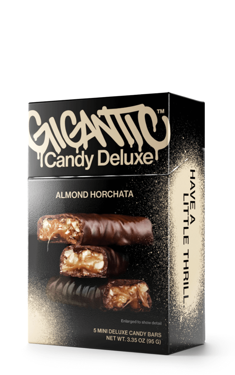 Gigantic Candy Deluxe Almond Horchata carton packaging with tan and black design.